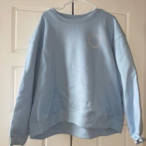 Blue Custom Sweatshirt with Stamp-Like Design on the Back